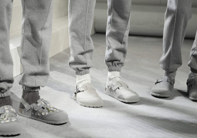 clothing footwear shoe sneaker person walking boy child male pants