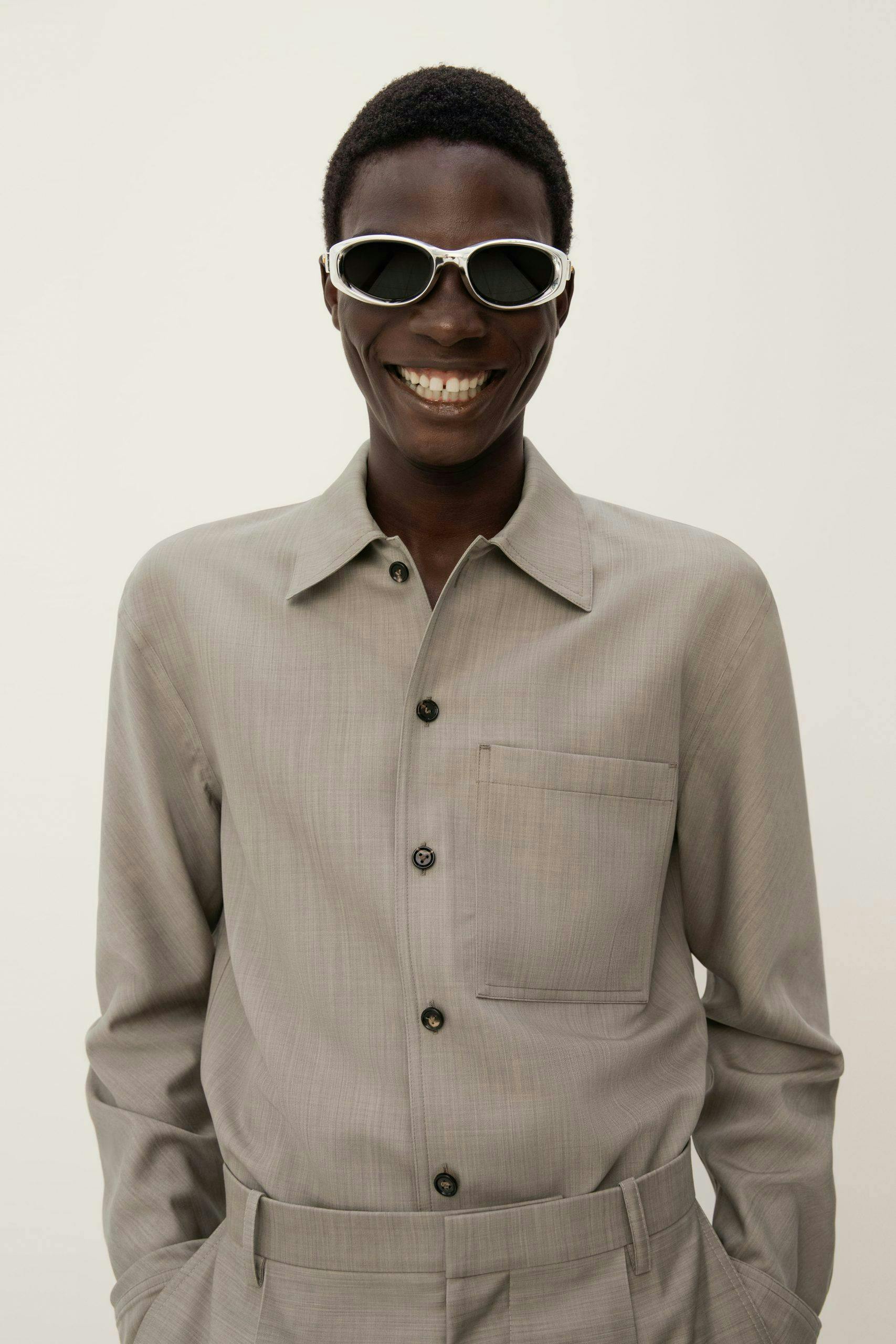 shirt face head person smile sunglasses coat suit adult man