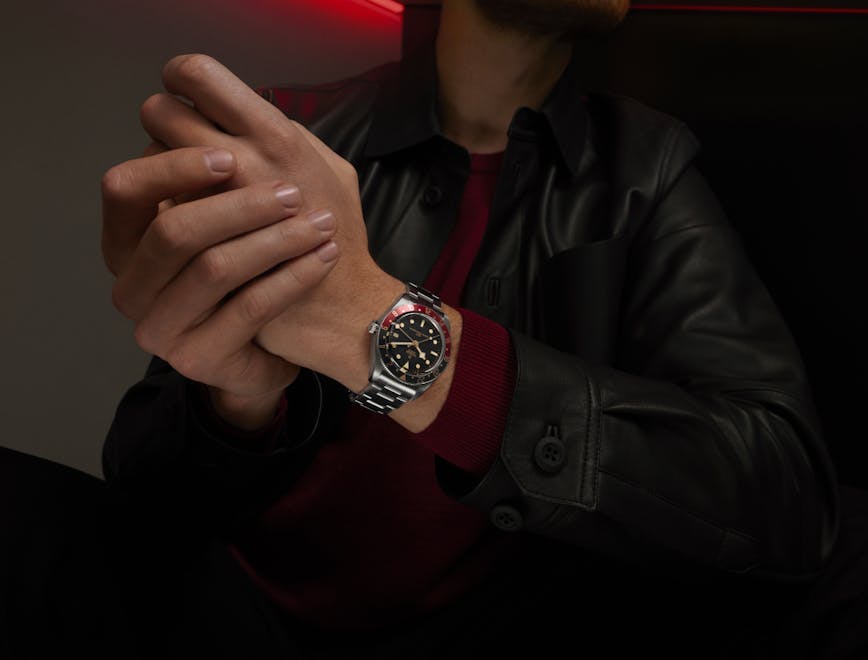 finger hand person coat jacket adult male man wristwatch wrist